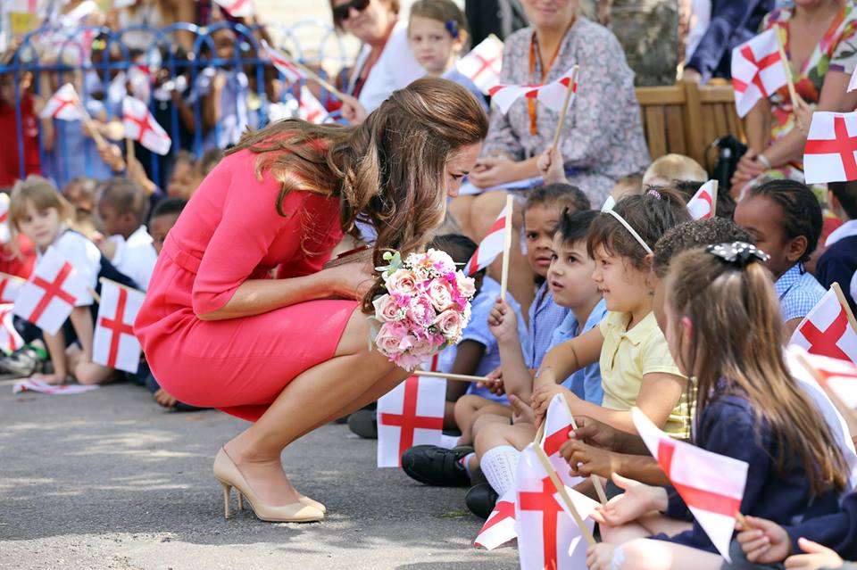 Kate bending to talk to kids