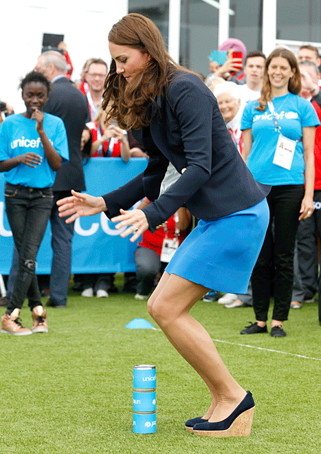 Kate jumping three tins