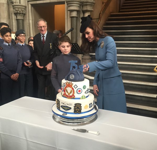 Kate cuts the cake with youngest air cadet