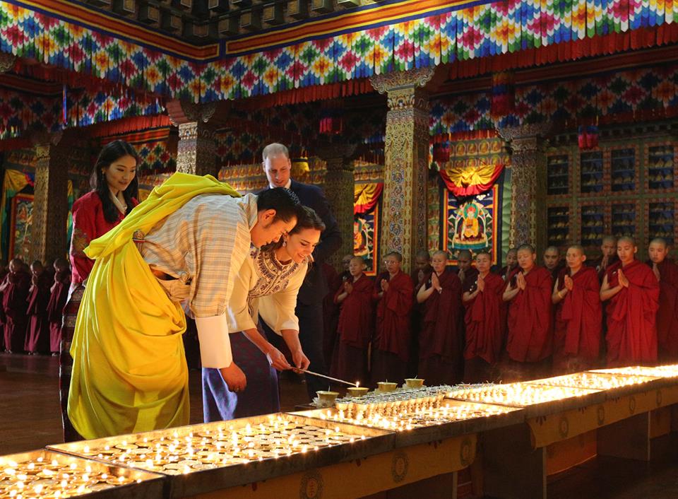 William and Kate, King and Queen of Bhutan light lamps
